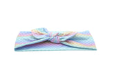 A cute knotted head wrap featuring a mermaid print for girls from By Bella Boutique.